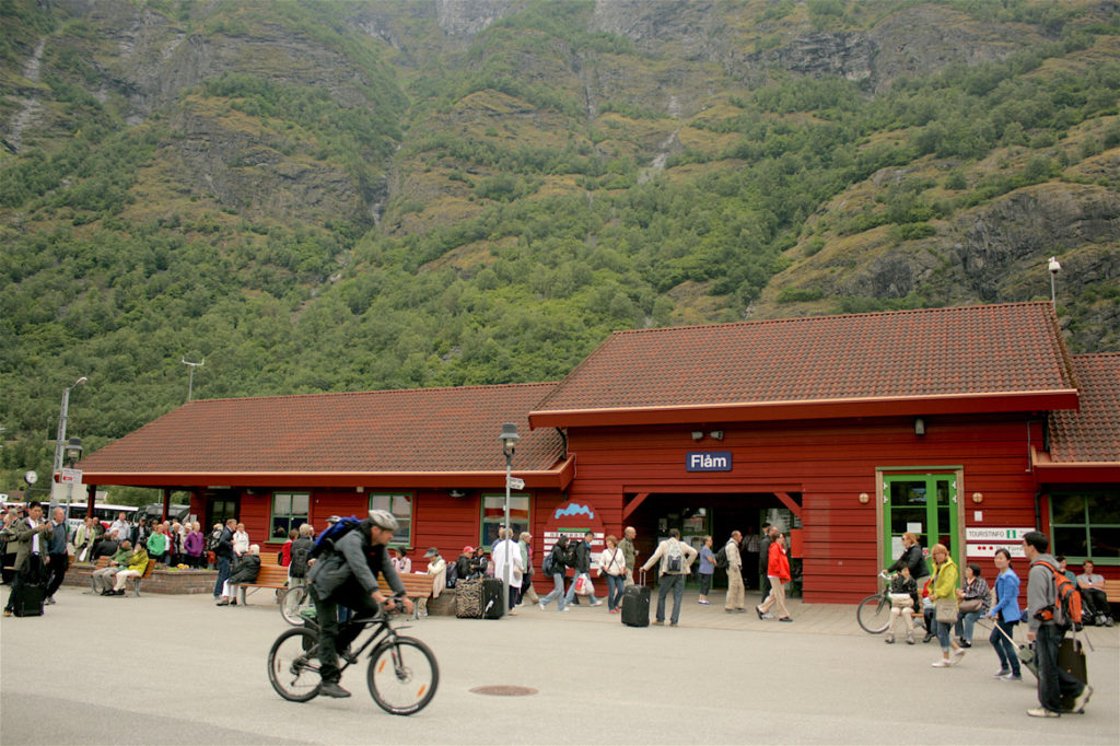 Flåm Railway Station, passengers at a railway station, cyclist, Norway in a Nutshell, Flåm Railway, Flåm, train, travellers, Sognefjord, Fjords, Visit Norway, Norwegian culture, landscapes, hill station, trip, journey, train journey, train ride, travel, Norway, Scandinavia, Nordic, travel